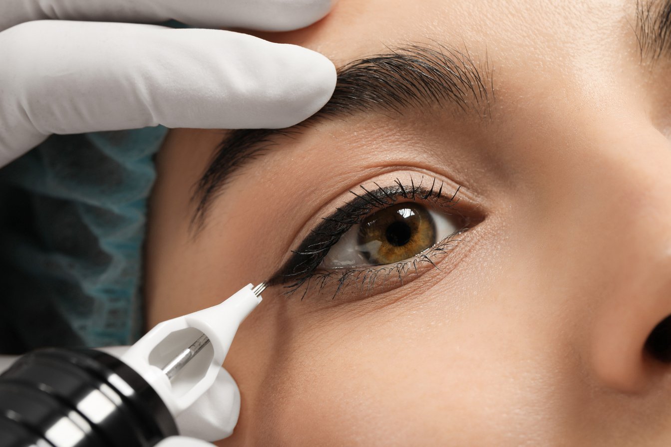 Young Woman Undergoing Procedure of Permanent Eyeliner Makeup, C